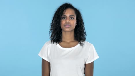 African-Girl-Shaking-Head-to-Reject-Isolated-on-Blue-Background