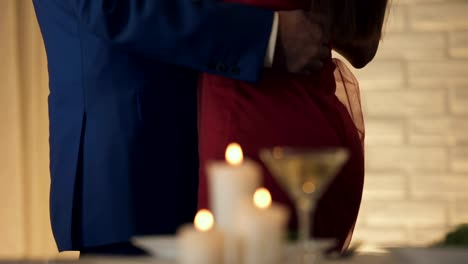 Close-up-of-loving-couple-dancing-on-romantic-date-in-restaurant,-true-feelings