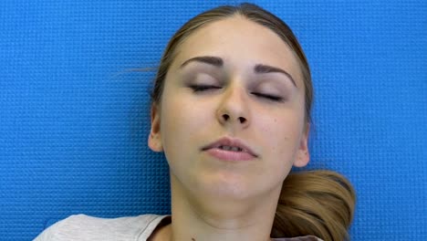 Girl-opening-her-eyes-after-emergency-resuscitation,-looks-around-frightened