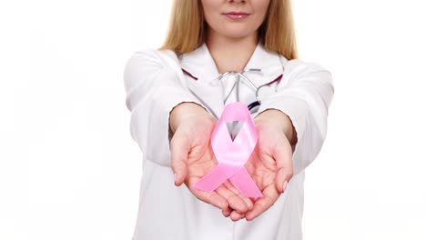 Woman-doctor-showing-pink-ribbon-aids-symbol-4K