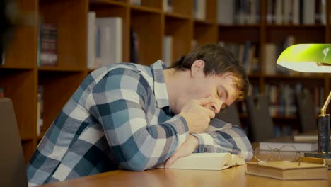 man-sleeping-on-the-book