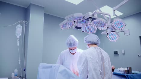 Medical-Team-Performing-Surgical-Operation-in-Bright-Modern-Operating-Room.