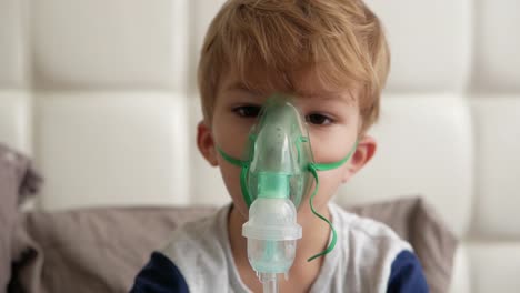 Boy-makes-inhalation.-medical-equipment