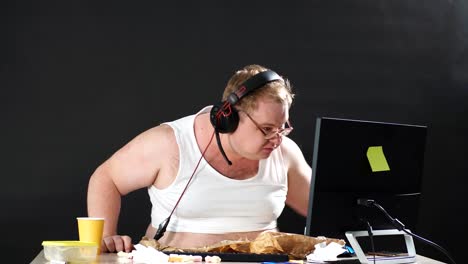 Angry-young-man-in-headset-playing-game-at-home