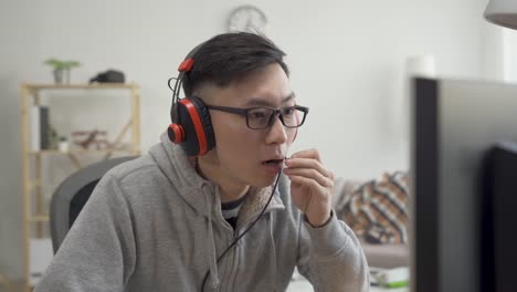 man-in-headset-playing-game-talk-with-partner