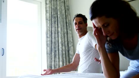 Unhappy-couple-having-an-argument-in-the-bedroom