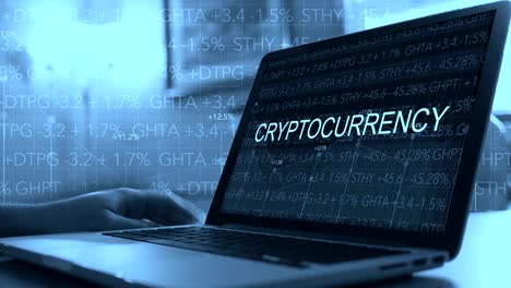 Cryptocurrency-concept-with-stock-market-ticker-scrolling-over-laptop---Cryptocurrency