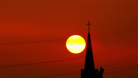 Time-Lapse-Church-Tower-And-Cross-at-Sunset