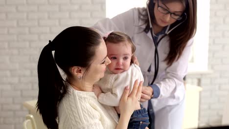 A-child-with-her-mother-at-a-doctor's-appointment.