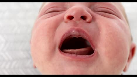 Face-of-a-newborn-baby-crying-close-up