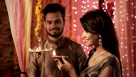 Newly-wed-bride-and-groom-in-a-house-interior-decorated-with-lights-and-flowers.