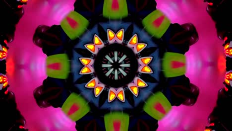 video-en-forma-de-un-caleidoscopio-de-mandala-forman-rotando-y-cambiando-que-se-abren-en-flores-y-formas-geométricas-con-movimiento-en-colores-y-en-fondo-negro