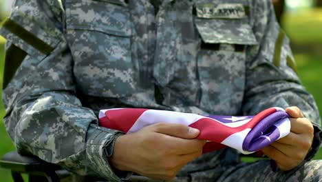 Veteran-of-war-holding-USA-flag,-came-to-funeral-of-commander,-honor-and-glory