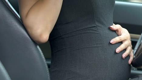 Scared-pregnant-businesswoman-calling-911,-needs-help-in-childbirth,-panic