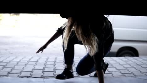 Female-and-male-zombies-are-chasing-the-girl-on-the-street.-Young-girl-running-in-scary-and-hiding-in-garage-around-the-corner.-Close-up-front-view