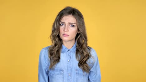 Young-Girl-with-Frustration-and-Anger-Isolated-on-Yellow-Background