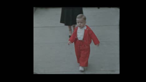 1954-Baby-boy-tries-to-unlock-old-antique-car