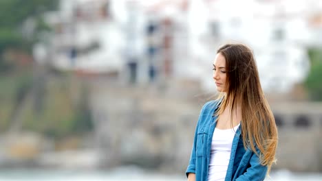 Melancholic-woman-looking-away-outdoors