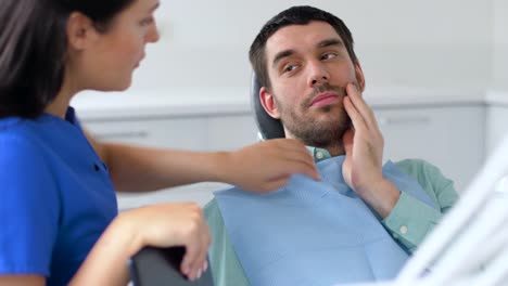 patient-with-toothache-at-dentist-office