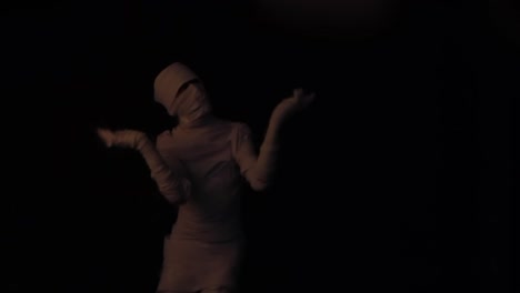 Blur-focus-scene-of-mummy-walking-in-darkness.