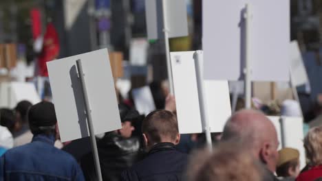 Crowd-activists-at-a-rally-with-posters-are-on-the-road-walking-banner-Europe.