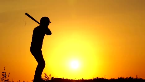 Silhouette-man-with-baseball-bat-to-practice