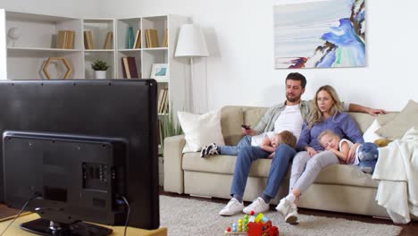 Couple-with-Children-Watching-TV