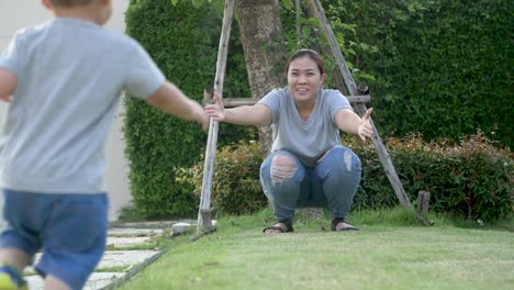 Accident-of-baby-boy,-Asian-son-is-running-to-the-mother-and-falls-on-the-way-in-the-garden,-Slow-motion