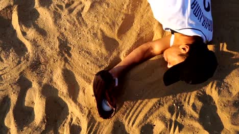 Men's-baseball-players-were-sliding-on-the-sandy-pitch