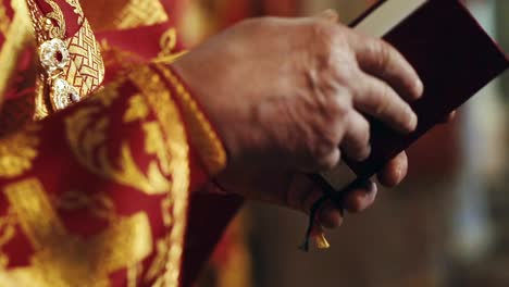 Orthodox-christian-priest-reading-church-book