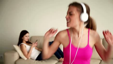 Young-woman-alone-at-home-singing-and-having-fun