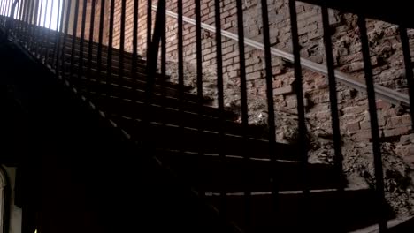 CLOSE-UP:-Detail-of-crumbling-wooden-staircase-in-decaying-residential-building