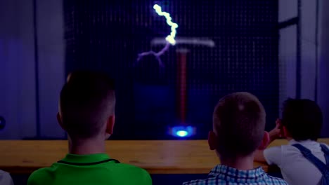 Teenagers-watches-musical-show-with-dancing-lightning-of-tesla-coil