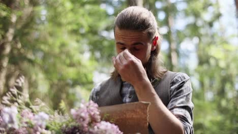 Young-groom-reading-paper-letter-declaration-of-love-full-emotions-tears-low-angle-view-green-background.-Hipster-man-festive-clothes-crying-over-valentine-card-promise-sunny-day-shallow-dof-romantic