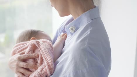 Affectionate-woman-breastfeeding-her-baby