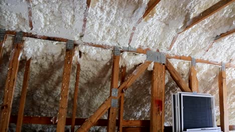 New-home-construction-with-installation-of-heating-system-on-the-roof-of-house-attic-under-construction