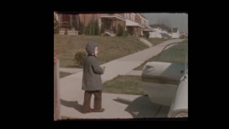 1959-Little-boy-fires-cap-gun-gets-in-vintage-car-with-Mom-and-drives-off