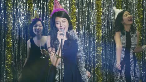 happy-music-women-singing-at-karaoke-party