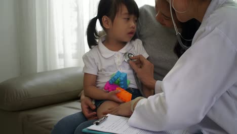 Doctor-Examining-Child