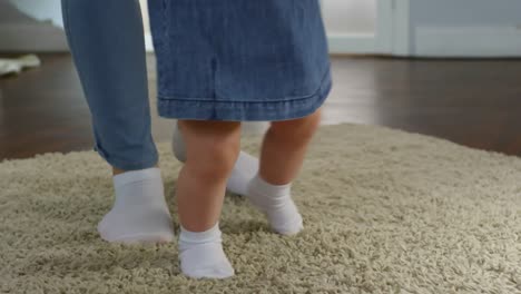 Baby-Girl-Walking-with-Mother’s-Support