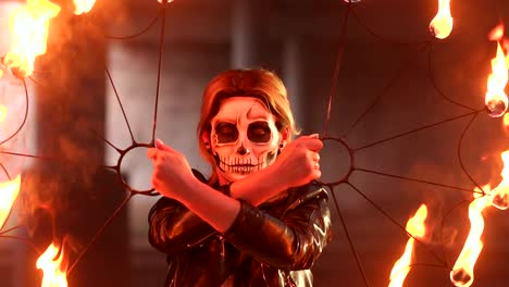 Creepy-bride-with-makeup-on-her-face-holding-burning-torches.-Halloween.