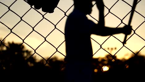 Baseball-players-practice-at-sunset