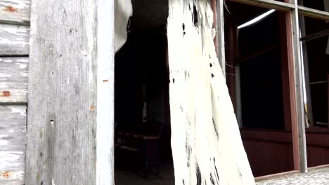 CLOSE-UP:-Looking-through-the-window-at-a-classroom-in-dilapidated-haunted-house