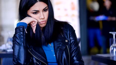 Sad-And-thoughtful-asian-Woman-sitting-in--bar--outdoor