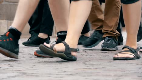 Feet-of-Crowd-People-Walking-on-the-Street-in-Slow-Motion