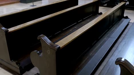 Wooden-Pews-in-a-Christian-Church-Aisle