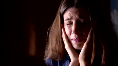 depressed-young-woman-crying-looking-at-mirror