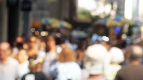 Commuters-walking-down-busy-city-street-people-on-sidewalk