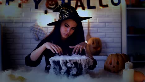 Beautiful-witch-performing-mysterious-magic-ritual,-cooking-potion-in-cauldron