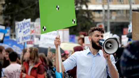 Man-at-political-meeting-with-banner-with-points-for-tracking-to-copy-space-text